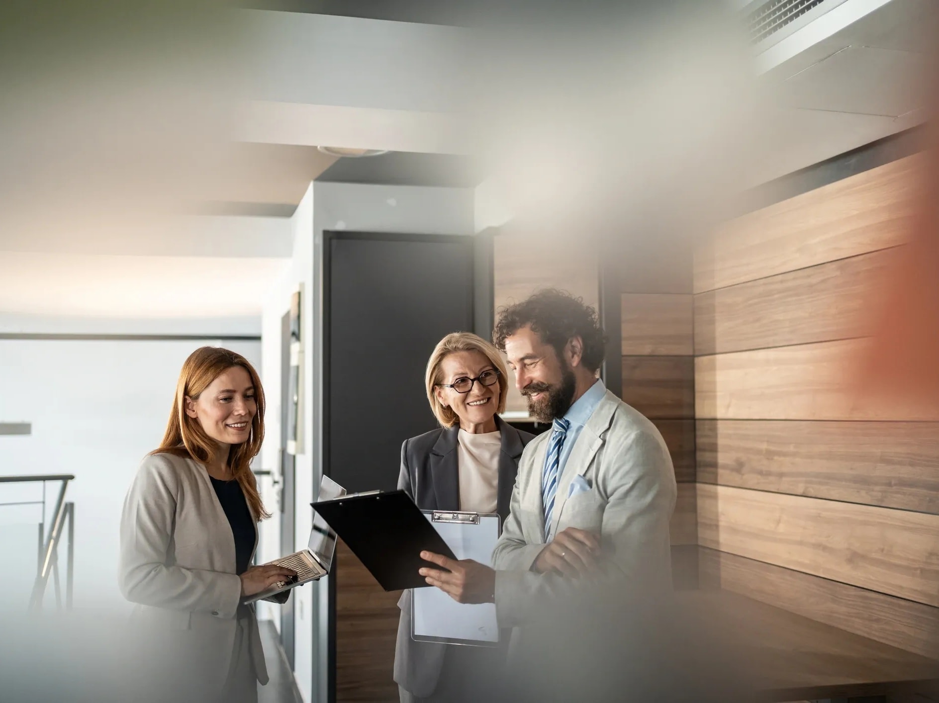 Students walking through a modern office corridor